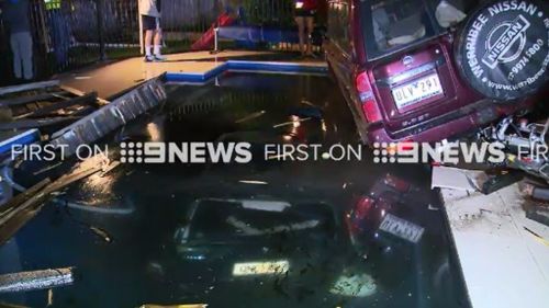 Cars plunge into Melbourne swimming pool after crash outside home