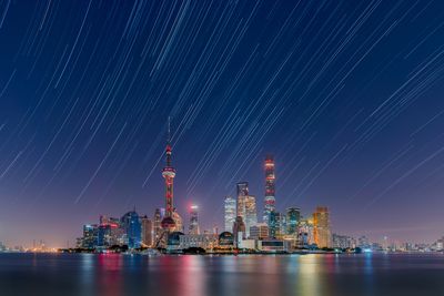 Star trails over the Lujiazui City Skyline by Daning Kai