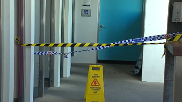 A man has been stabbed in a public bathroom on the Gold Coast.