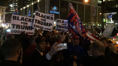 Supporters of the Republican are beginning to converge outside Trump Tower. (AFP)
