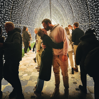 Irena and Locky Gilbert share a loving embrace under a canopy of lights in Kings Park in Perth.