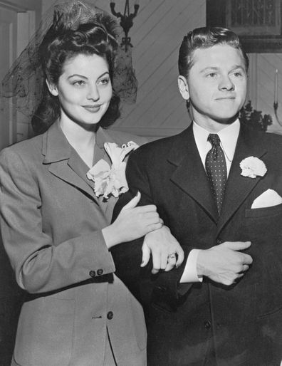 Mickey Rooney Ava Gardner pose for camermen after marriage ceremony at the Santa Ynez Valley Presbyterian Church.