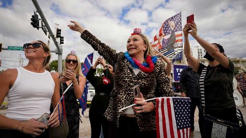 Supporters in Palm Beach wait for Donald Trump.