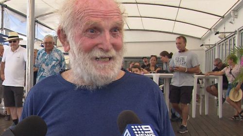 Bill Hatfield chats with the media after stepping back onto dry land.