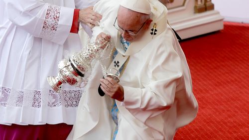 The pontiff stumbled on an altar step. (AAP)