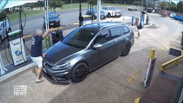 Thieves drive off with Toowoomba petrol station owner Clint Webber on bonnet. 