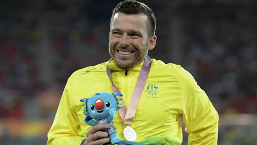 The 37-year-old with his silver medal from the men's T54 1500m. (AAP)