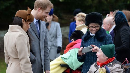 Prince Harry and Meghan Markle meet people outside St Mary Magdalene Church . (PA Wire)