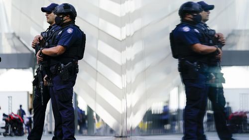 Police officers stand guard at the National September 11 Memorial and Museum 