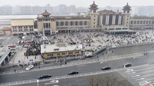 The train arrives at Beijing station with accompanying motorcade. Picture: AP