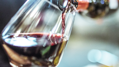 Red wine poured into a wine glass