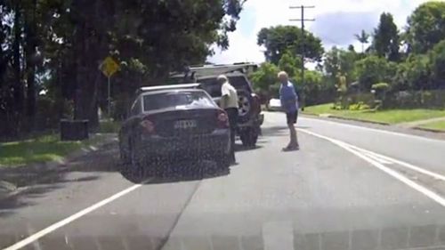 It is unknown at this stage why the men stopped brawling and returned to their respective cars. (Dash Cam Owners Australia)