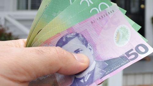 The New Zealand dollar plummeted after a surprise half-per cent interest rate cut.