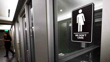 Gender neutral signs are posted in the 21C Museum Hotel public restrooms on May 10, 2016 in Durham, North Carolina. (AFP)