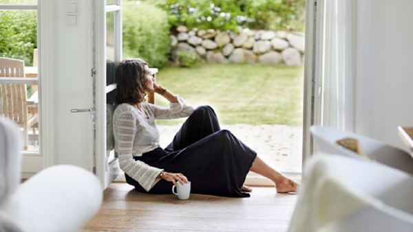 Woman sitting in doorway. 