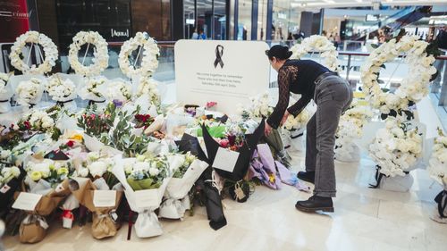 Members of the public pay their respects at the Westfield Bondi Junction shopping centre during a day of reflection on April 18, 2024.