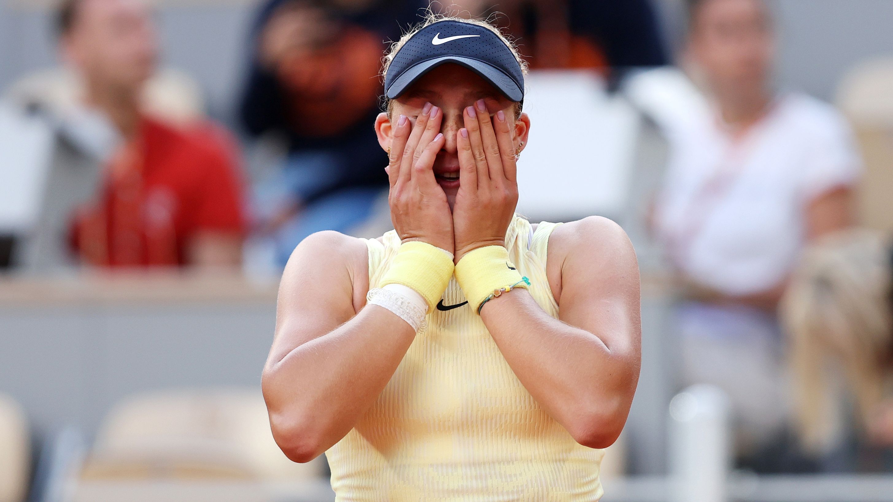 Mirra Andreeva reacts after winning match point against Aryna Sabalenka.