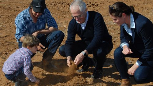 Australian Prime Minister Malcolm Turnbull is seen with farmer Phillip Miles, his wife Ashley and their son Jack during a visit to Trangie, NSW last month. (Photo: AAP)