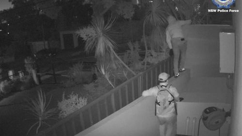 CCTV footage shows two members breaking and entering a property in Sydney.