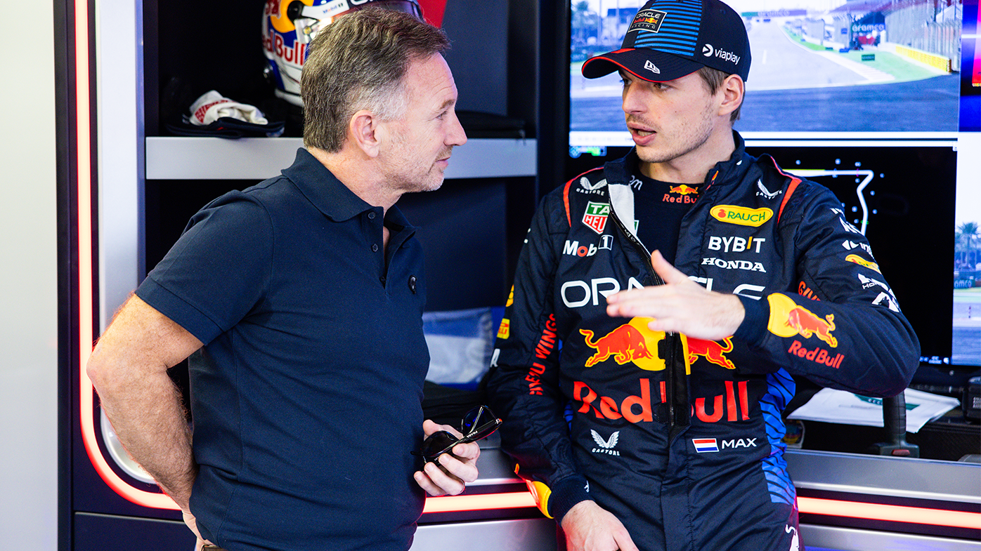 Max Verstappen talks with Red Bull Racing Team Principal Christian Horner in the garage on day one of F1 pre-season testing.