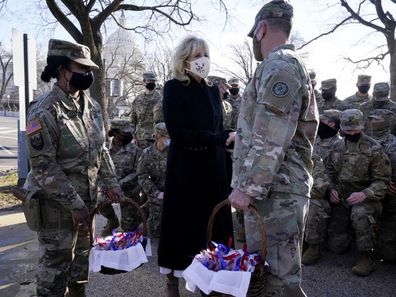 First lady Jill Biden surprises National Guard members  chocolate chip cookies. (AP Photo/Jacquelyn Martin, Pool)