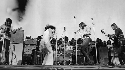 Singer Grace Slick performs with the American rock group Jefferson Airplane at Woodstock music festival. 