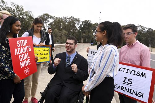 Senator Jordan Steele-John met students outside the grounds of parliament.