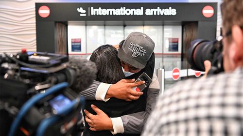 A family reunion at Auckland Airport after the New Zealand-Australia travel bubble opened in April this year.