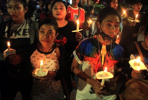 Indonesians have held candle light vigils for the people killed in the IS-inspired bombings. (AAP)