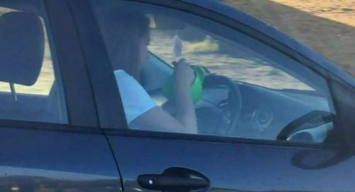 The cereal offender was busted driving while eating a bowl of food in Perth yesterday morning. (9NEWS)