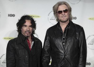FILE - Hall of Fame Inductees, Hall & Oates, John Oates and Daryl Hall appear in the press room at the 2014 Rock and Roll Hall of Fame Induction Ceremony on April, 10, 2014, in New York.  Hall has sued his longtime music partner John Oates, arguing that his plan to sell off his share of a joint venture would violate a business agreement the duo had. (Photo by Andy Kropa/Invision/AP, File)