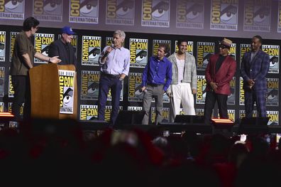 Rob Delaney, from left, Kevin Feige, Harrison Ford, Tim Blake Nelson, Danny Ramirez, Giancarlo Esposito, and Anthony Mackie attend a panel for Marvel Studios during Comic-Con International 