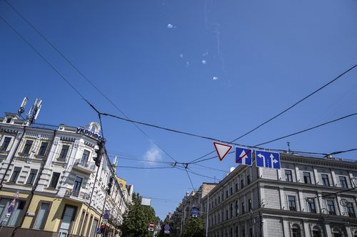 Tracks and white smoke are seen in the sky during Russian rocket attack in Kyiv, Ukraine, Monday, May 29, 2023. 