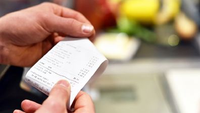 Man holding receipt