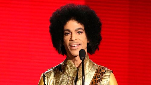 Prince presents the award for favourite album - soul/R&amp;B at the American Music Awards in Los Angeles in 2015. (AP)