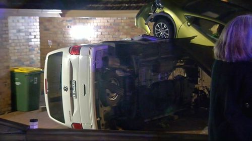 A car slammed through a fence, smashed into a parked van and then burst into flames in Melbourne overnight.