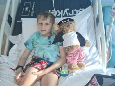 Eli with his Kids' Cancer Project bear