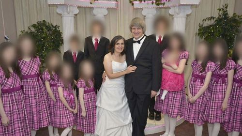David and Louise Turpin, pictured with their 13 children who they tortured and abused.