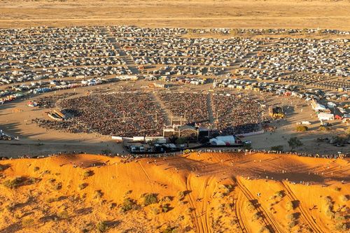 The Big Red Bash, the self-proclaimed world's most remote music ﻿festival, is scrambling to find another venue after a rare deluge hit outback Queensland.