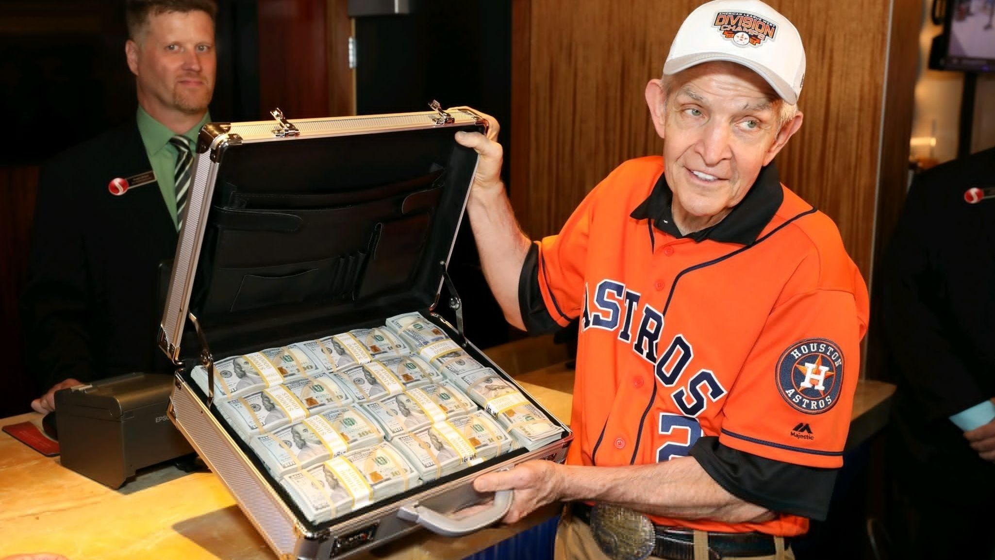 Jim McIngvale poses with his USD$75m in winnings.