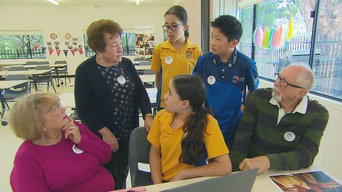 Seniors learn new technology from school kids