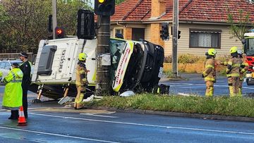 Three people hospitalised after an ambulance rollover in Preston Victoria. 