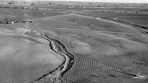 The wreckage was strewn over a vast swath of land, with the plane's tail seen at the bottom right of this picture.
