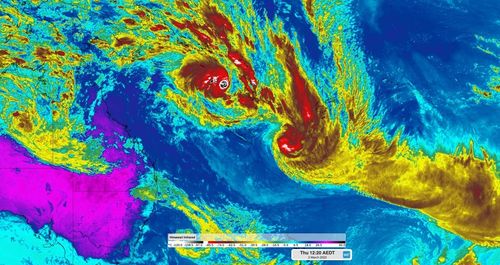 Two tropical cyclones are swirling off Queensland's coast and are expected to follow similar paths.