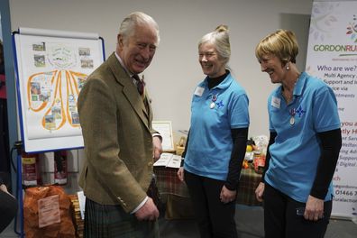 King Charles III reacts during a visit to the Aboyne and Mid Deeside Community Shed to meet with local hardship support groups and tour the new facilities, in Aboyne, Aberdeenshire, Scotland, Thursday, Jan. 12, 2023 