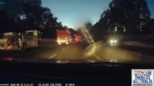 Extraordinary dashcam footage captured the loose key smashing into one motorist's windscreen. (Dashcam Owners Australia)