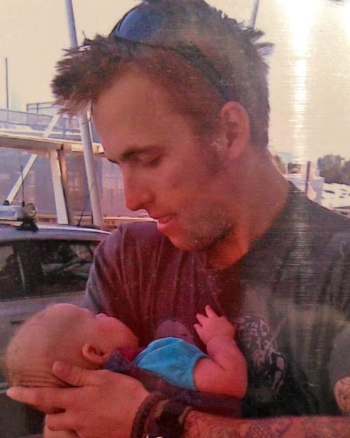Matt Page, pictured at Sydney airport, meeting baby Willow for the first time.