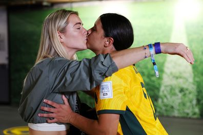 Sam Kerr of Australia celebrates with her partner Kristie Mewis of USA after her team's victory through the penalty shoot out against France.