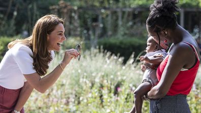 Kate Middleton, Duchess of Cambridge meets with MUSH mother and baby group member, Morgan Alex Cassius and her 6 month old, Makena Grace during a visit to Battersea Park, London, Tuesday, Sept. 22, 2020