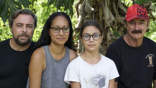 A group who have been stranded in Tahiti, pictured from left, Benjamin Baude, Kissy Ika Chavez Baude, Gaïa Baude Ika and Thierry Gourtay in Afareaitu on Moorea Island, Tahiti, Saturday, September 19, 2020